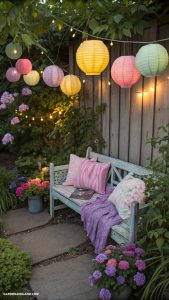 small backyard gardens Colorful lanterns illuminating a cozy seating area