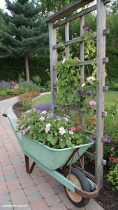 wheelbarrow planter ideas Trellis attached to a wheelbarrow for climbing plants